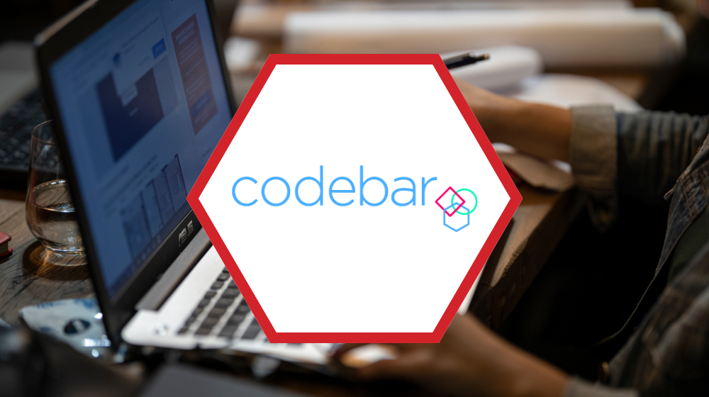A person working on a laptop, the codebar logo