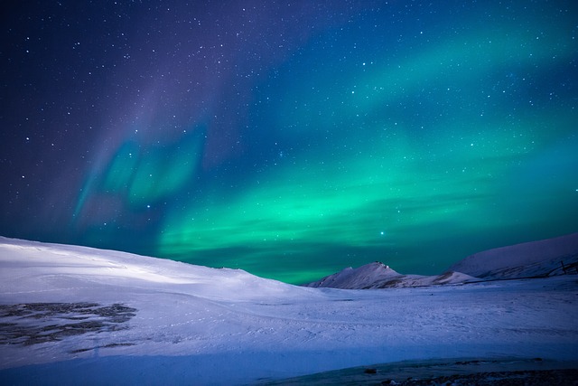 Aurora on a snowy hill