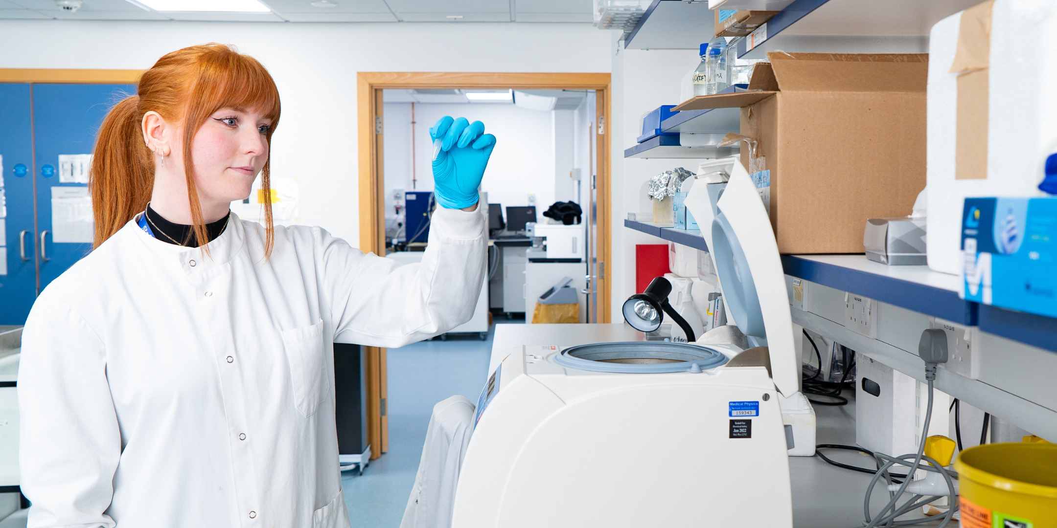 A woman holding a test tube