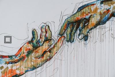 mural of two hands reaching out for each other
