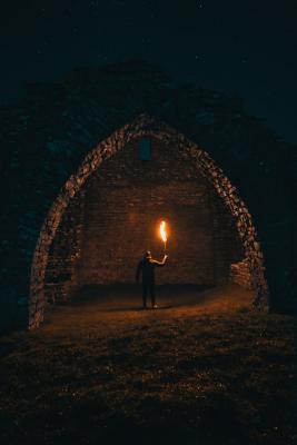 Man holding torch in the dark
