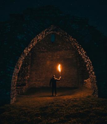 Man holding flare in the dark