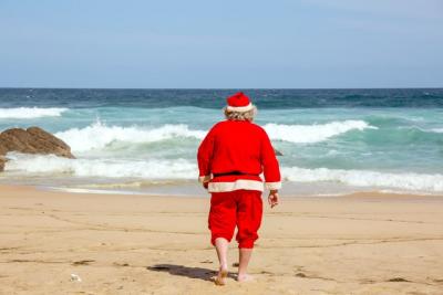 Santa heading off for a summer dip at the beach