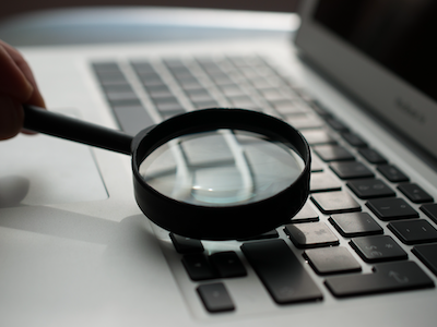 Magnifying glass used on laptop keyboard