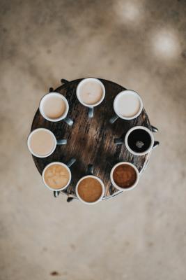 Different coloured coffee in cups