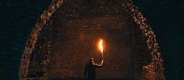 Man holding torch in the dark