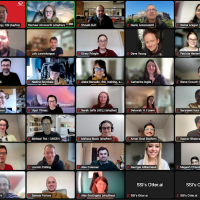 Zoom screen showing many people participating in a video call