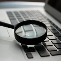 magnifying glass on laptop keyboard