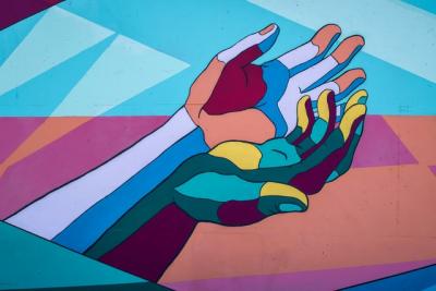 colourful abstract hands holding each other